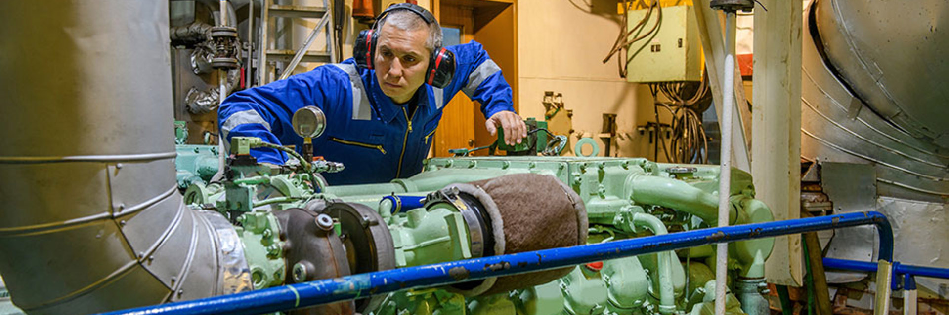 Engineer inspecting motor engine load